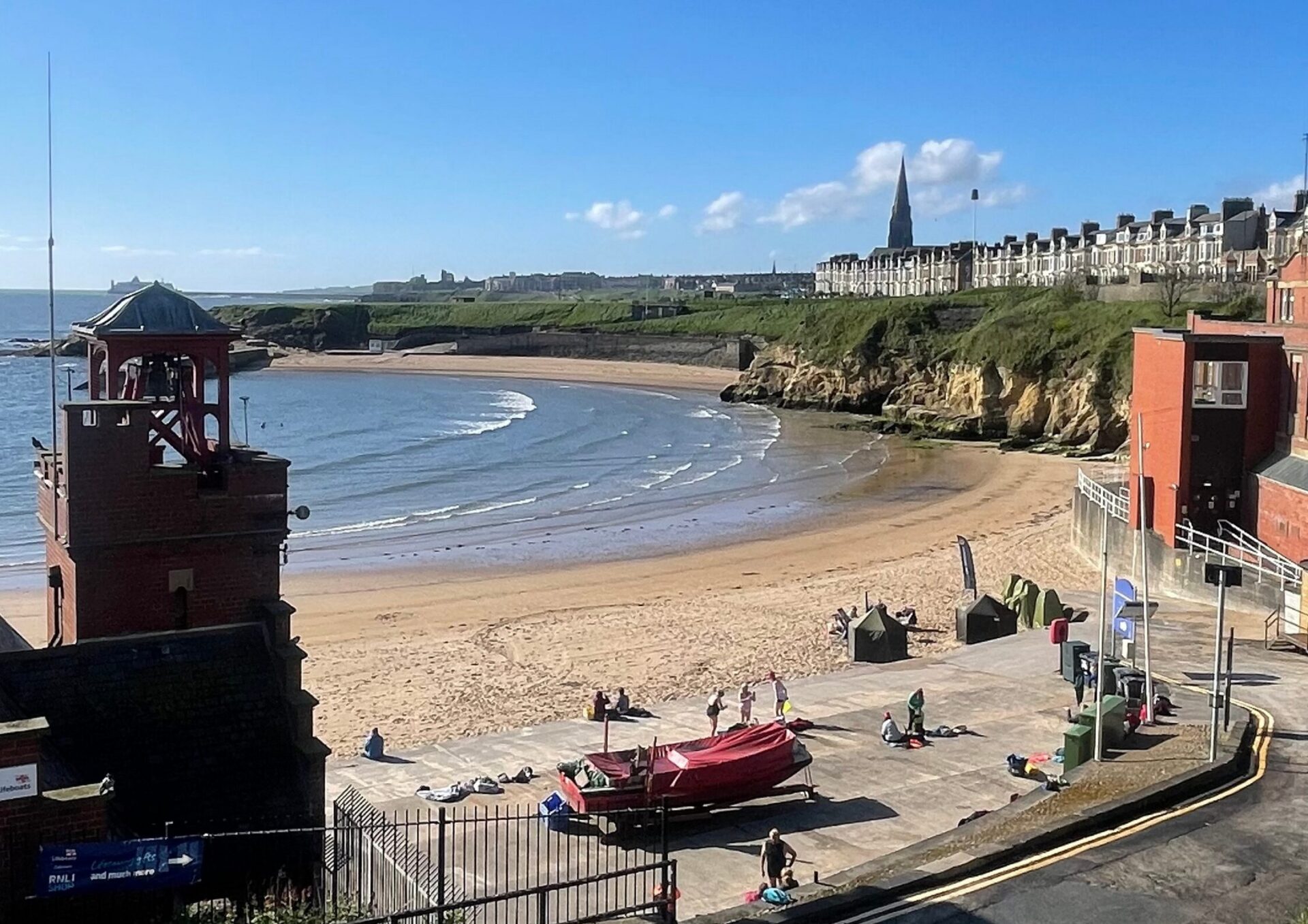 View of cullercoats beach and harbour on a sunny day.