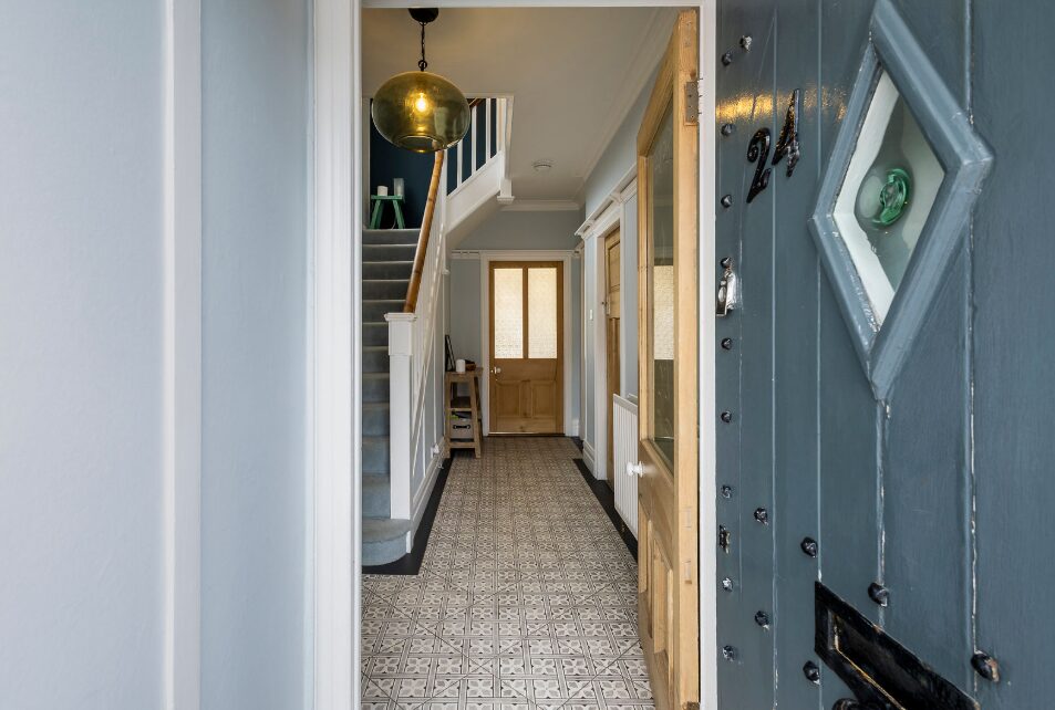 Hallway viww from and open blue front door