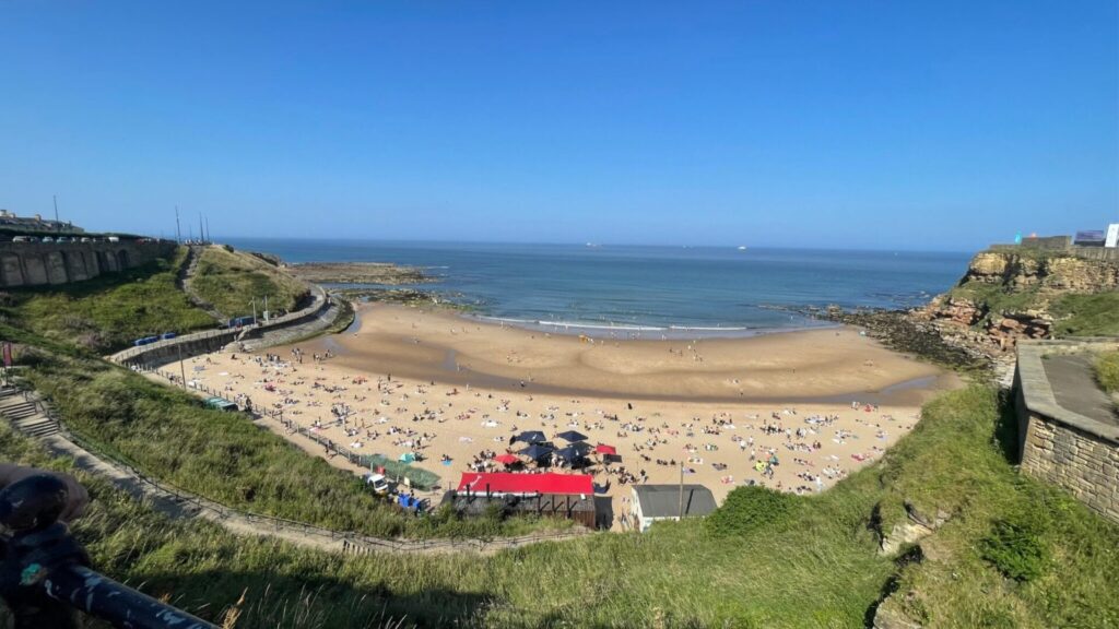 Aerial view of a sandy beach and coastline at Tynemouth on the Northumberland coast