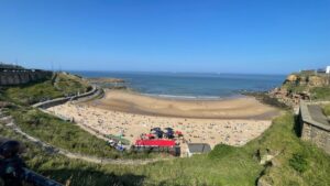 Aerial view of a sandy beach and coastline at Tynemouth on the Northumberland coast
